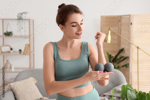Sporty young woman massagin...
