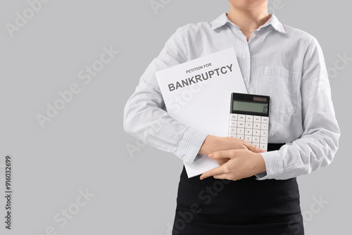 Businesswoman with calculat...