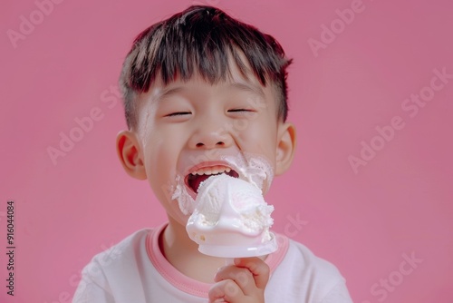 Young child enjoying breakfast demonstrates essence of simple joy. Cute little boy playful expression eating bite of food. Universal happiness that food brings highlighted child's smile.