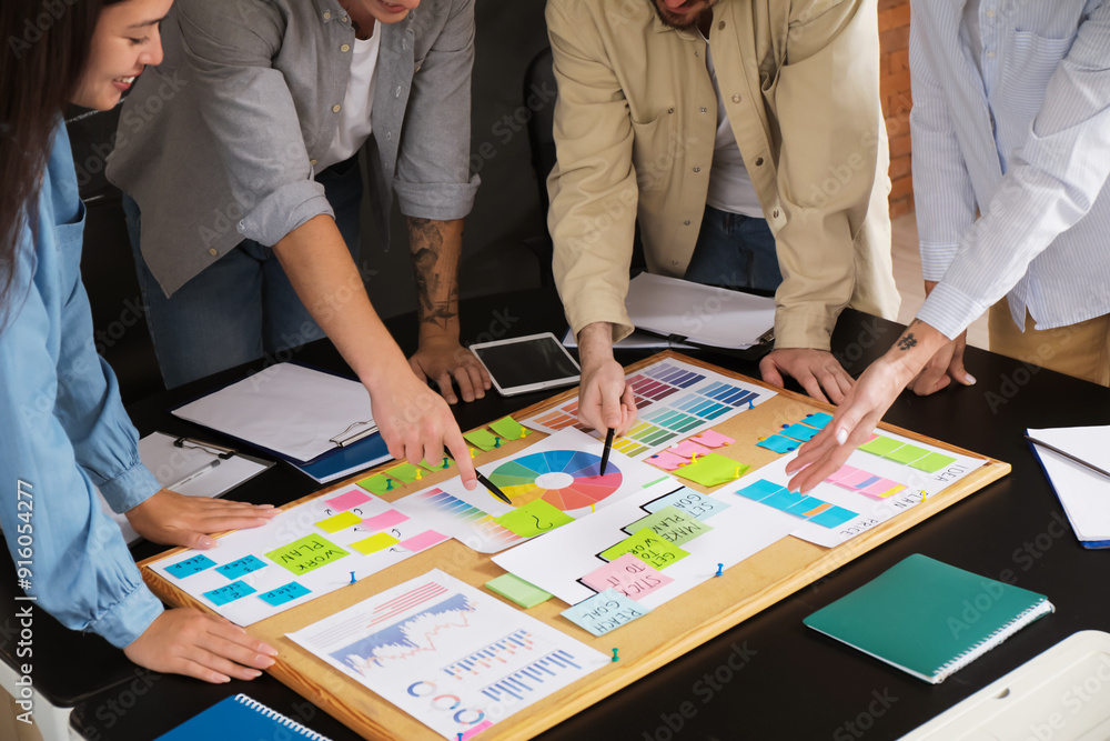 © Pixel-Shot - Colleagues working on business plan at table in office, closeup © Pixel-Shot - Colleagues working on business plan at table in office, closeup