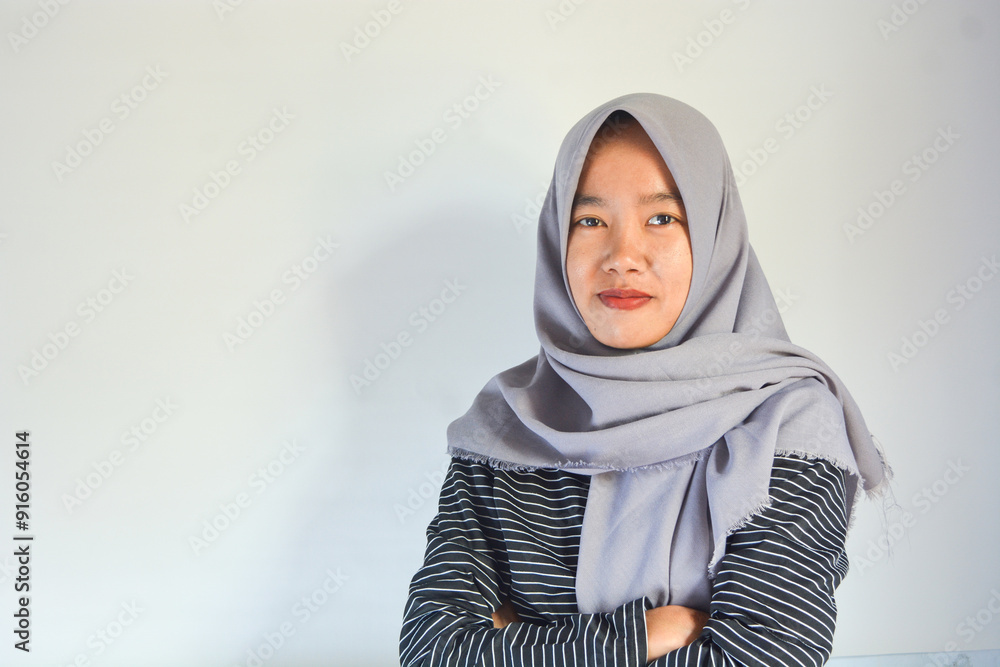 Portrait of a confident Asian woman facing the camera on an isolated background Portrait of a confident Asian woman facing the camera on an isolated background