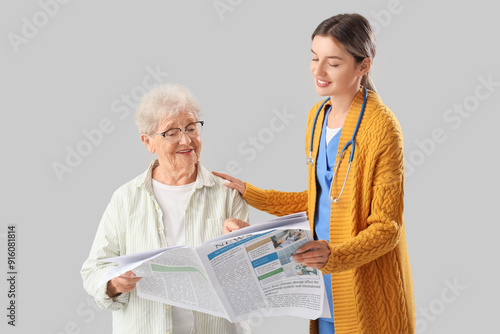 Senior woman with nurse rea...