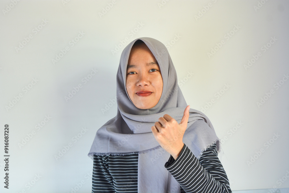 Young cheerful happy smiling pleasant successful employee business woman in her 20s wearing casual brown classic jacket showing okay okay gesture isolated on plain pastel light pink background studio Young cheerful happy smiling pleasant successful employee business woman in her 20s wearing casual brown classic jacket showing okay okay gesture isolated on plain pastel light pink background studio