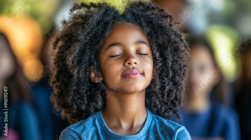 Young girl with eyes closed.