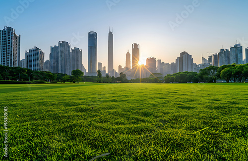 City sunrise and meadow