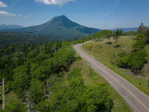 Obraz na płótnie Hokkaido, Japan: Aerial view of the road in the Akan-Mashu National Park with the Mount Oakan volcano in Hokkaido in summer in Japan. w salonie