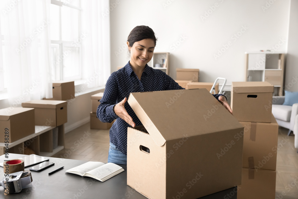 Small business owner, female warehouse worker preparing parcel for dispatch, sending box through reliable courier company. Workflow of online store merchant using sales platform, electronic commerce Small business owner, female warehouse worker preparing parcel for dispatch, sending box through reliable courier company. Workflow of online store merchant using sales platform, electronic commerce