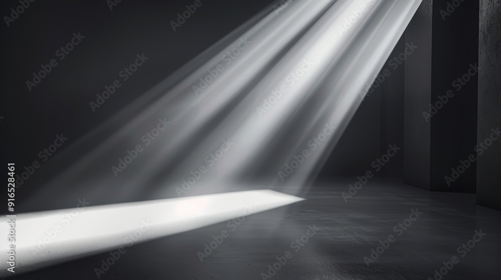 Obraz premium Focused beams of light break through the darkness, casting sharp shadows and creating an intense and dramatic visual composition.