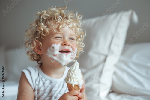 Kid's favorite moment is enjoying ice cream. Charming little boy sporting modern hairstyle smiling warmly. Tender portrayal of happiness and purity of child's spirit.