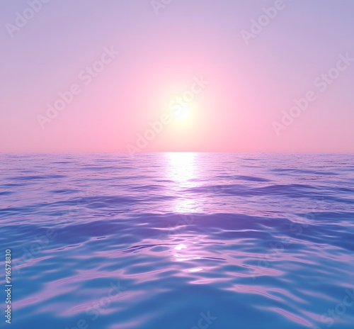 Calm sea with pink sunset reflecting in the water.