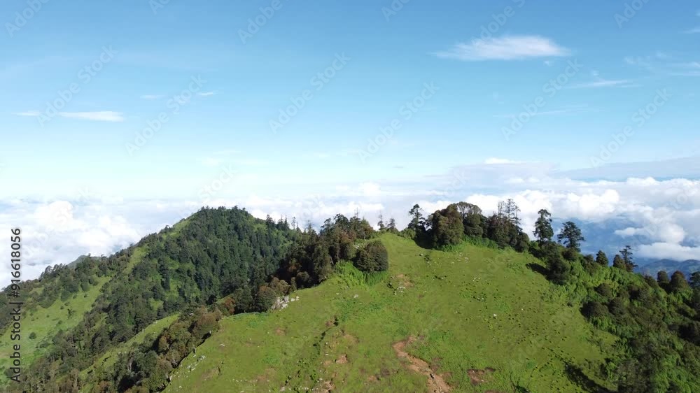 Beautiful view of the mountains from the drone. Flying drone over forests and moving clouds on mountains. green jungle, clean sky and moving clouds on top of mountain. Beautiful mountain landscape Beautiful view of the mountains from the drone. Flying drone over forests and moving clouds on mountains. green jungle, clean sky and moving clouds on top of mountain. Beautiful mountain landscape