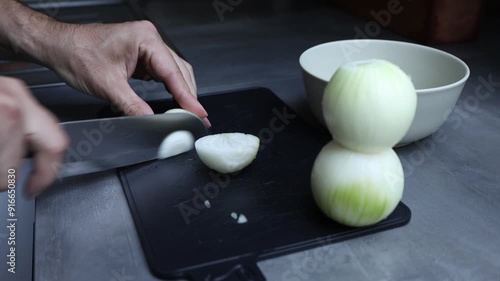 Man's Hands slicing Onion. Close up photo