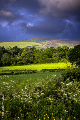 View of moody Moel Famau mountain taken from Cilcain, Wales photo