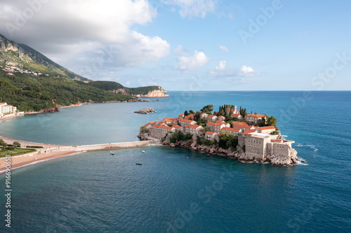 Amazing Aerial around view of Sveti Stefan resort island in Montenegro. The small old town of Sveti Stefan and resort in Montenegro photo