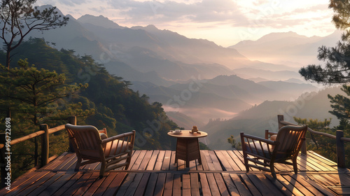 Two wooden chairs and a table with tea sit on a rainy porch, overlooking misty mountains.