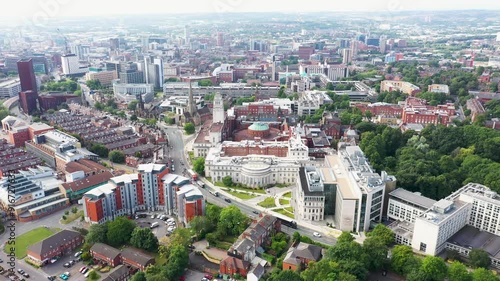 Aerial footage of the Leeds town of Headingley, the footage shows the famous Leeds University campus and the town centre in the background with roads and traffic, taken on a beautiful sunny day. photo