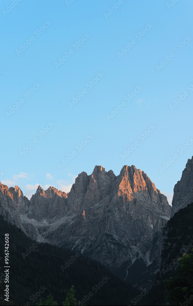 Rocky peaks of the Italian Dolomites in the morning rays of the rising sun. Rocky peaks of the Italian Dolomites in the morning rays of the rising sun.