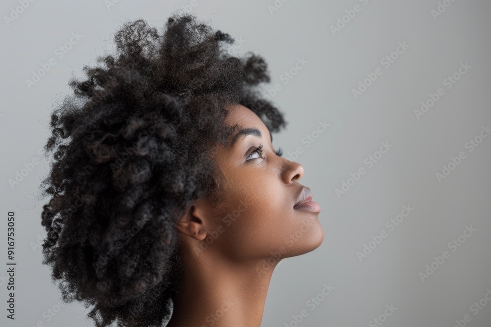 Black woman with afro contemplating in studio with vision, thoughts, or white background and staring up. With concept, brainstorming, focus, fashion, or quiet by backdrop, girl Black woman with afro contemplating in studio with vision, thoughts, or white background and staring up. With concept, brainstorming, focus, fashion, or quiet by backdrop, girl