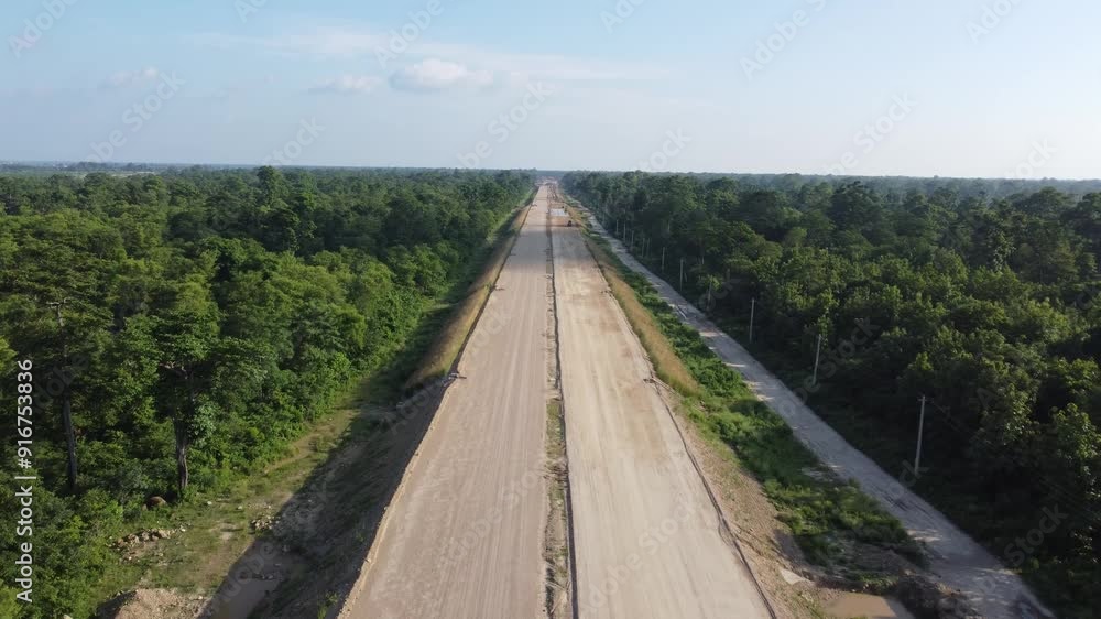 Aerial view of highway road construction in Nepal. Construction site. Kathmandu–Terai Expressway, also known as Fast Track, is an under construction road connecting Kathmandu and Nijgadh in souther Aerial view of highway road construction in Nepal. Construction site. Kathmandu–Terai Expressway, also known as Fast Track, is an under construction road connecting Kathmandu and Nijgadh in souther