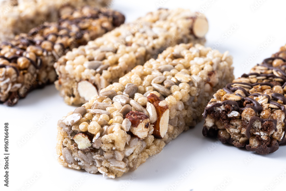 Healthy Muesli bar with nuts and seeds isolated on white background Healthy Muesli bar with nuts and seeds isolated on white background