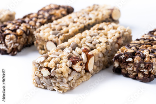 Healthy Muesli bar with nuts and seeds isolated on white background