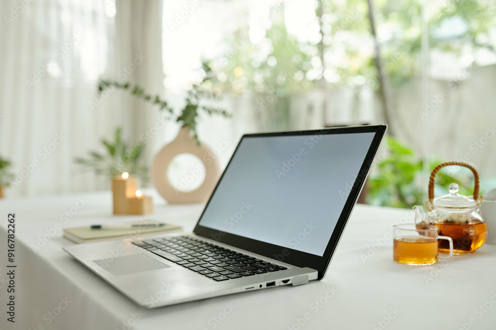 Fototapeta premium Laptop for freelance work on table in the room