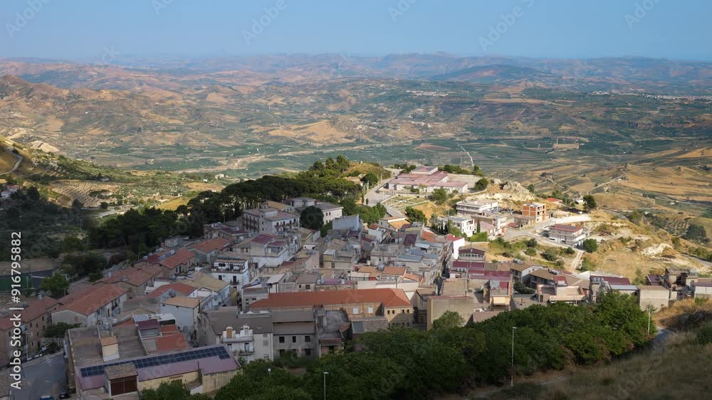 View from the village of Caltabellotta down to the landscape of southern Sicily, Italy View from the village of Caltabellotta down to the landscape of southern Sicily, Italy