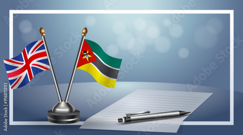 United Kingdom and Mozambique Small national flag on bokeh background, cooperative relationship