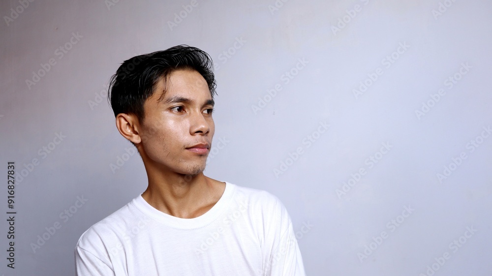 close up of handsome asian young man wearing white shirt close up of handsome asian young man wearing white shirt