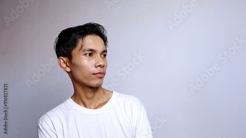 close up of handsome asian young man wearing white shirt