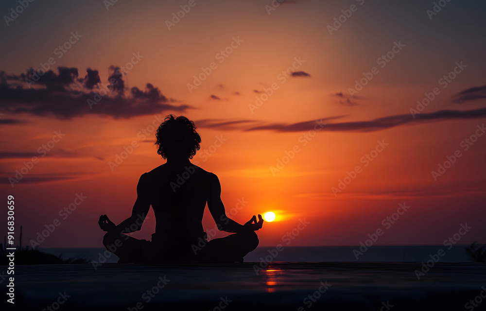 silhouette of a man meditating at sunset. silhouette of a man meditating at sunset.