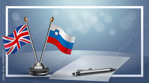 United Kingdom and Slovenia Small national flag on bokeh background, cooperative relationship