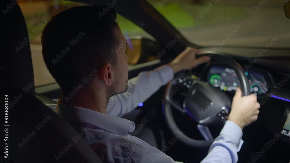 Driving at night with utmost concentration and control in a modern, stylish vehicle Driving at night with utmost concentration and control in a modern, stylish vehicle