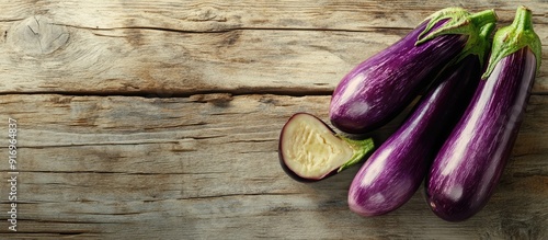 Half cut eggplants on a dis...