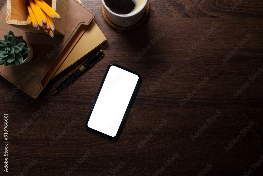 Modern workplace with smart phone notebook on wooden table. Copy space and blank screen for your advertise design. Modern workplace with smart phone notebook on wooden table. Copy space and blank screen for your advertise design.