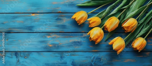 Yellow tulips on a rustic b...