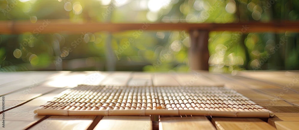 Wooden deck table with a bamboo place mat ideal for displaying items with copy space image Wooden deck table with a bamboo place mat ideal for displaying items with copy space image