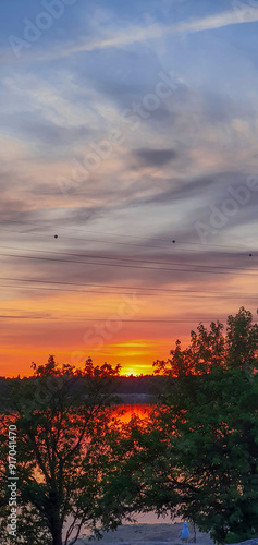 beautiful sunset in orange intensive colors in hietaniemi beach in helsinki finland