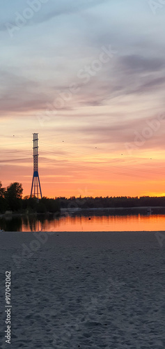 beautiful sunset in orange intensive colors in hietaniemi beach in helsinki finland