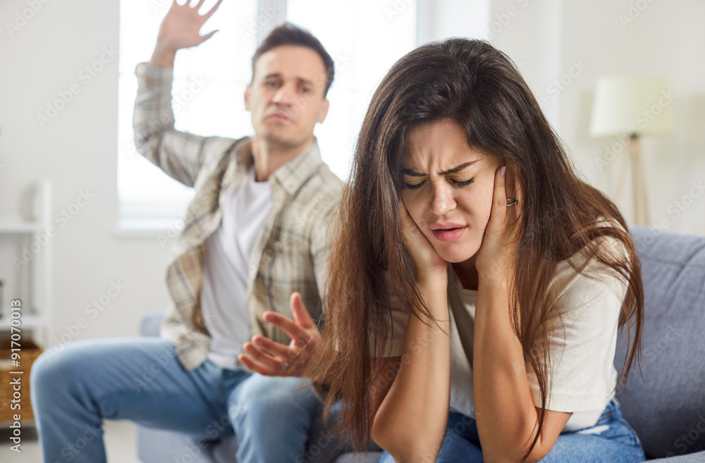 Physical abuse, frightened scared young defenseless woman victim hiding from aggressive man attack, abusive husband threaten to beat upset crying wife with hand, fear of domestic violence at home Physical abuse, frightened scared young defenseless woman victim hiding from aggressive man attack, abusive husband threaten to beat upset crying wife with hand, fear of domestic violence at home