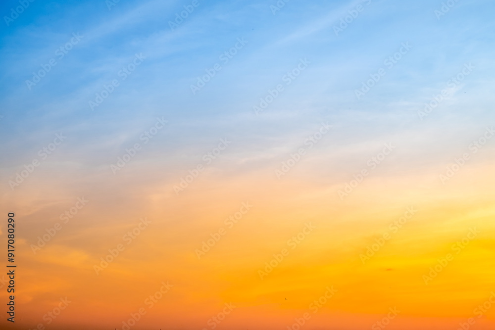 Fototapeta premium Beautiful , luxury soft gradient orange gold clouds and sunlight on the blue sky perfect for the background, take in everning,Twilight, Large size, high definition landscape photo