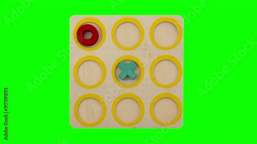 play tic-tac-toe wooden board game, circle symbol wins, green screen background, stop motion, 4k