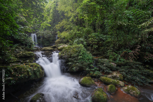 Beautiful and natural waterfall in the tropical rainforest. concept of nature, outdoor, forest, green, travel. Sapan waterfall, Thailand.