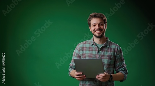 portrait of a male IT technician on a green background