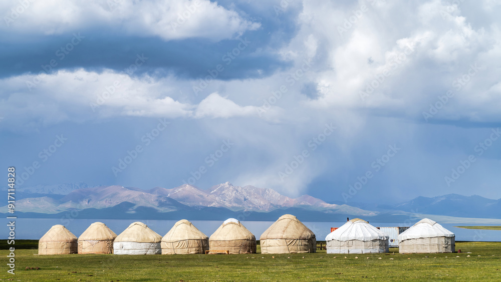 Traditional yurt camp at the Song Kul lake plateau in Kyrgyzstan, showcasing the nomadic lifestyle with portable felt tents used as accommodations. Traditional yurt camp at the Song Kul lake plateau in Kyrgyzstan, showcasing the nomadic lifestyle with portable felt tents used as accommodations.