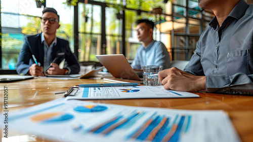 property dealers discussing inflation rate increased Mortgage loading and property document concept for real estate , small home with architect working with pen in blur background	
