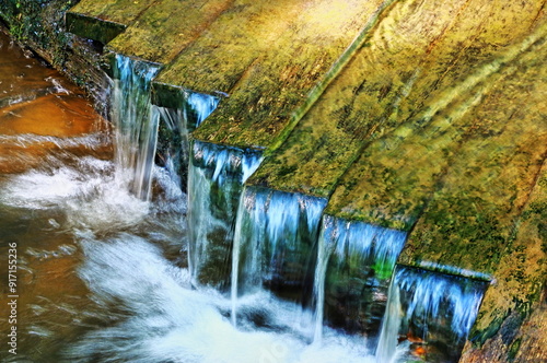 Mountain Stream Water Flowing Over A Footbridge