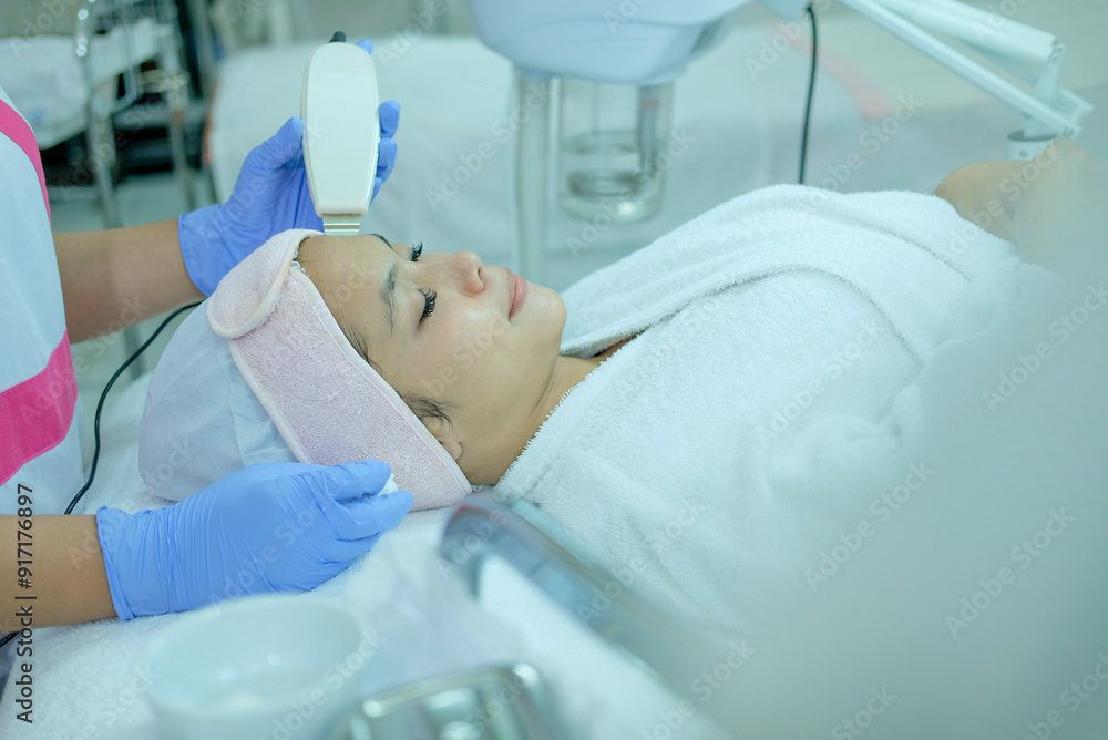 Beauty therapist doing facial treatment Beauty therapist doing facial treatment