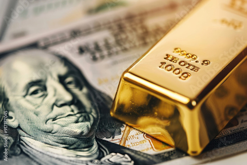 Close-up of a gold bar next to a hundred-dollar bill, symbolizing wealth and investment in valuable assets. photo