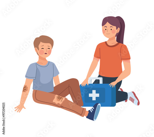 woman giving first aid to injured boy